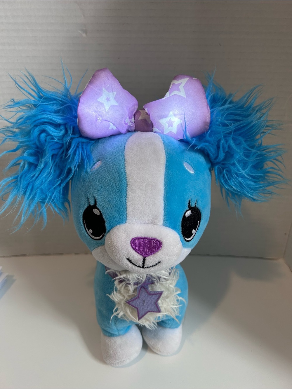 Wish Me Original Blue Cavalier Puppy with Purple Bow light up LED plush